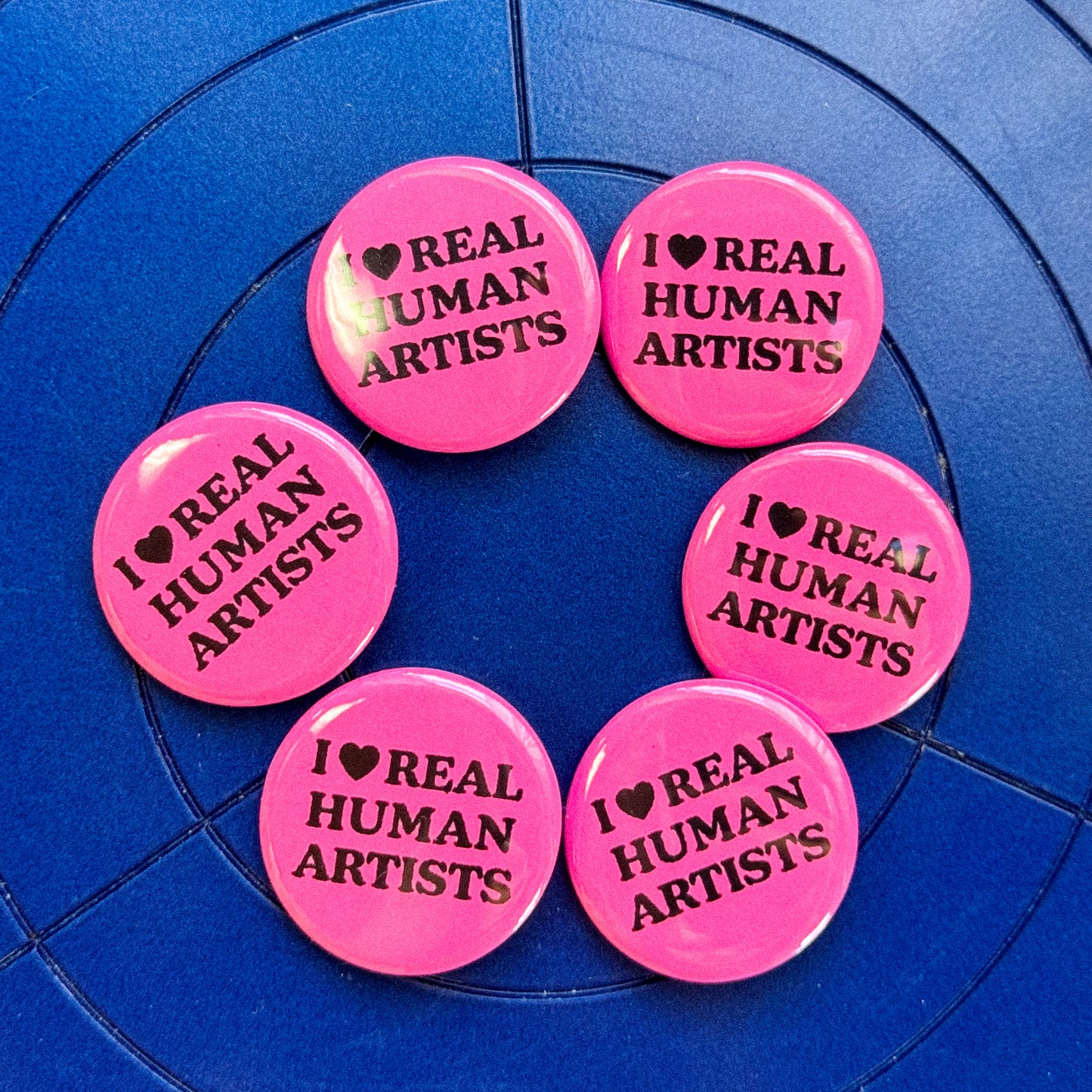 REAL HUMAN ARTISTS PINBACK BUTTON